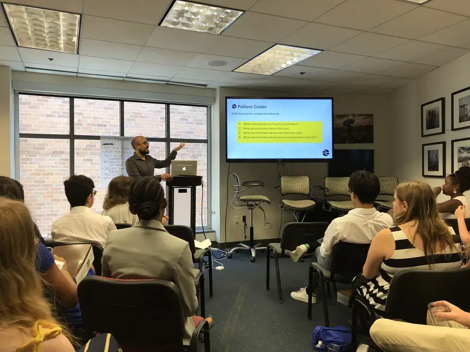 Pulitzer Center education team member introduces the role of the Pulitzer Center in news media. Washington, D.C. 2019.