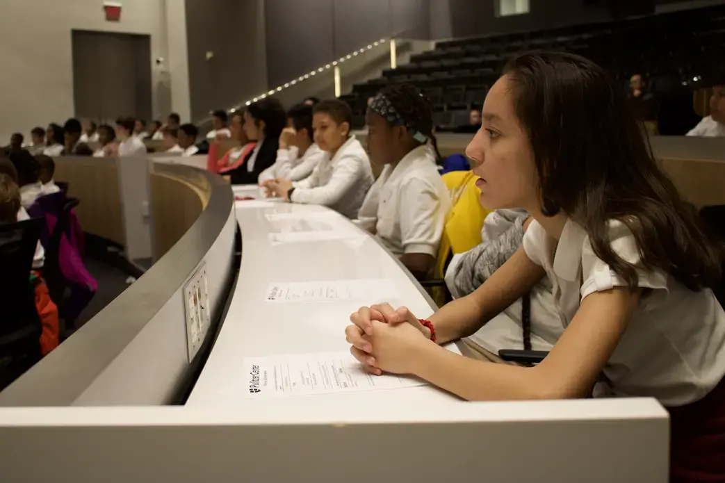 Students listen to the panelists discussing their work process and what it takes to be a journalist. Image by Alyssa Sperrazza. United States, 2018.