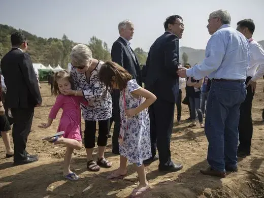 Chris Branstad talks with her granddaughters Stella and Sofia Costa while attending the groundbreaking ceremony of the China-US Demonstration Farm on Saturday, Sept. 23, 2017, in Luanping County, Hebei, China. Image by Kelsey Kremer. China, 2017.
