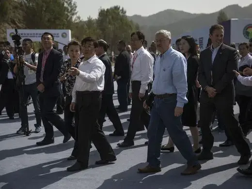 Hebei Party Secretary Zhafo Kezhi and Ambassador Terry Branstad walk together through the groundbreaking ceremony for the China-US Demonstration Farm on Saturday, Sept. 23, 2017, in Luanping County, Hebei, China. Image by Kelsey Kremer. China, 2017.