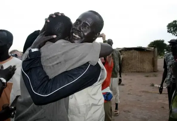 Koor Garang meets his father for the first time in almost 20 years. Image by Gabriel Bol. Sudan, 2007. Media file: lost.boys_.sudan_.jpg