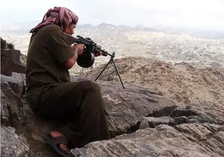 Mohamed Tamah, a leader of the south Yemen separatist movement, gets some target practice outside his village in Yafa. Media file: mercenary.jpg