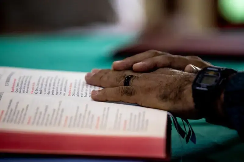 Father Amaro Lopes celebrates a mass in a chapel at the bishop’s house in Altamira. Image by Spenser Heaps. Brazil, 2019.