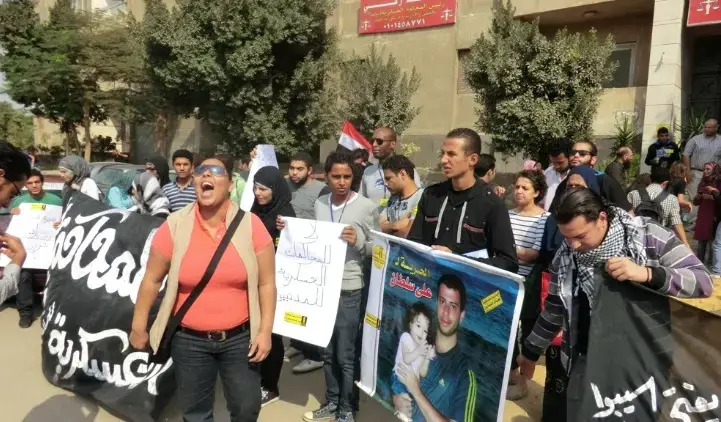 Rasha Azab leads a protest outside the military court in Cairo. Image by Sharif Abdel Kouddous. Egypt, 2011. Media file: militaryprotest.jpg