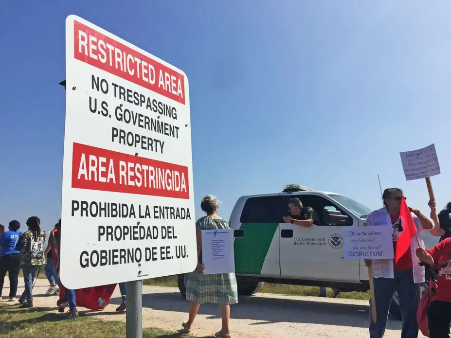 Activists march near the Lower Rio Grande Valley National Wildlife Refuge on February 16, protesting the construction of new border wall segments. Image by April Reese. USA, 2019. Activists march near the Lower Rio Grande Valley National Wildlife Refuge on February 16, protesting the construction of new border wall segments. Image by April Reese. USA, 2019.
