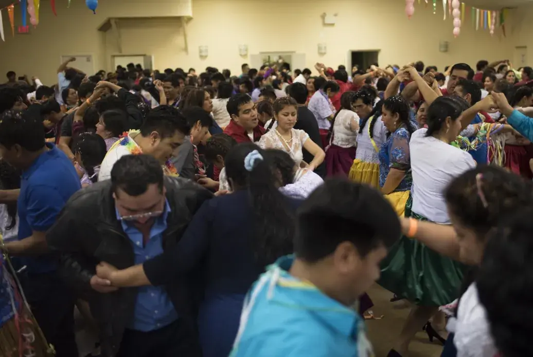 The Virginia residents of Santa Rosa hosted the first carnival party of 2016 in Annandale, Virginia. Every year, the Valle Alto community has at least two parties each weekend from February to March. Carnival happens at the time of harvest in Bolivia. Singing and dancing are expressions of gratitude for the harvest and Mother Earth. Image by Carey Averbook. United States, 2016.
