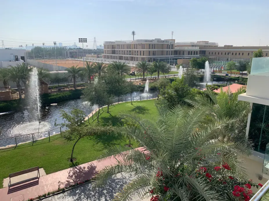 A view from the rooftop of a villa in The Sustainable City’s residential sector. The large tan building in the background is the newly-opened Fairgreen International School. Image by Anna Gleason. United Arab Emirates, 2019.