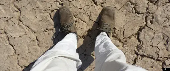 This photo taken Tuesday, Oct. 23, 2012 and released by the National Geographic Society on Thursday, Jan. 10, 2013, shows Paul Salopek standing on the desert flats in Djibouti. (AP Photo/National Geographic, Paul Salopek) Media file: r-PAUL-SALOPEK-WALK-large570.jpg