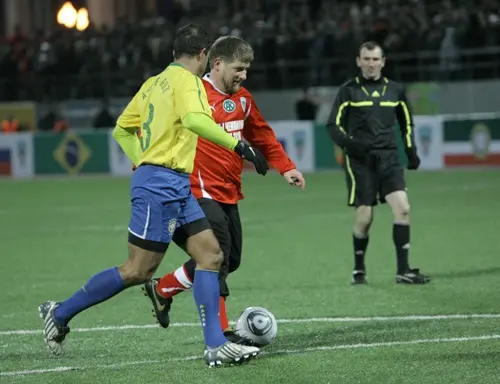 Ramzan Kadyrov (in red), the leader of Chechnya, plays in a friendly soccer match between Chechen players and a collection of Brazilian World Cup Winners in Grozny. Image: Musa Sadulayev, Russia, March 2011.