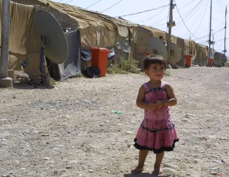 Residents of the Moqebleh refugee camp fled Syria in 2004-5 and have not
forgotten government repression. Image by Reese Erlich. Iraq, 2011. Media file: reesesyria.jpg