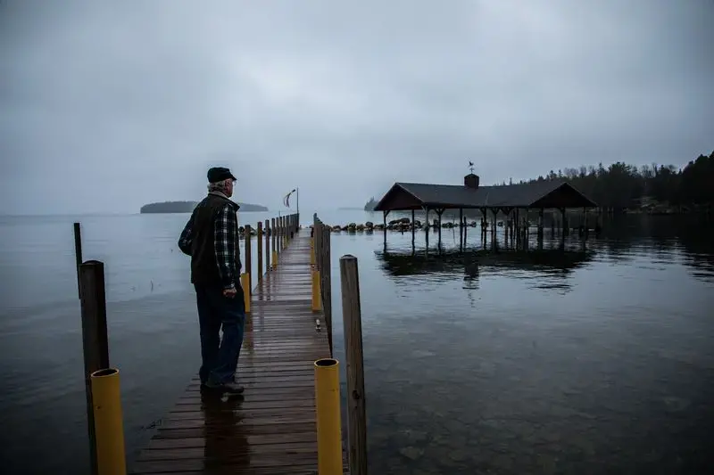 Robert Smith, president of Les Cheneaux Watershed Council, at his home in the Upper Peninsula of Michigan on Nov. 20, 2019. 'You're living on the lake, on the lake's terms,' he said. Image by Zbigniew Bzdak / Chicago Tribune. United States, 2020.