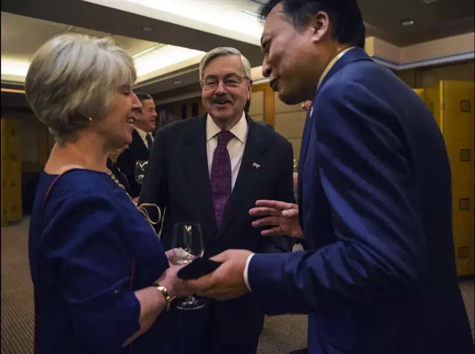 Terry Branstad, U.S. ambassador to China, with his wife Chris, speak with guests during an Iowa Sister States reception on Wednesday, Sept. 20, 2017, in Beijing, China. Image by Kelsey Kremer. China, 2017. 
