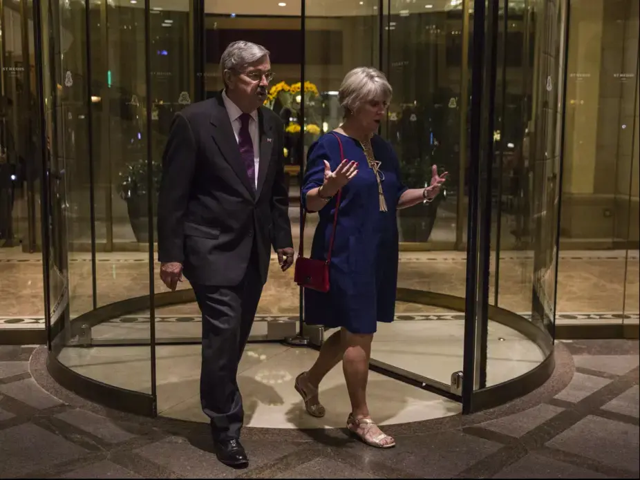Terry Branstad, U.S. ambassador to China and his wife Chris Branstad leave the St. Regis hotel after an Iowa Sister States reception on Wednesday, Sept. 20, 2017, in Beijing, China. They walked home to their embassy residence, only a few blocks away, after the reception. Image by Kelsey Kremer. China, 2017. 
