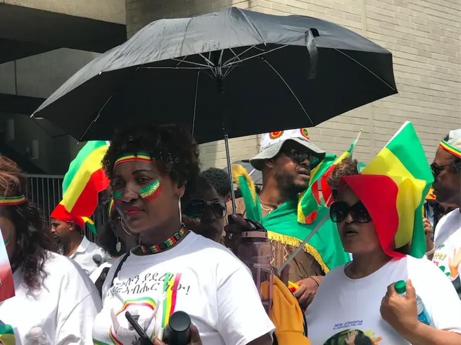 Many people were wearing T-shirts with pictures of Abiy surrounded by Ethiopia's colors. Image by Jazmin Goodwin. United States, 2018.