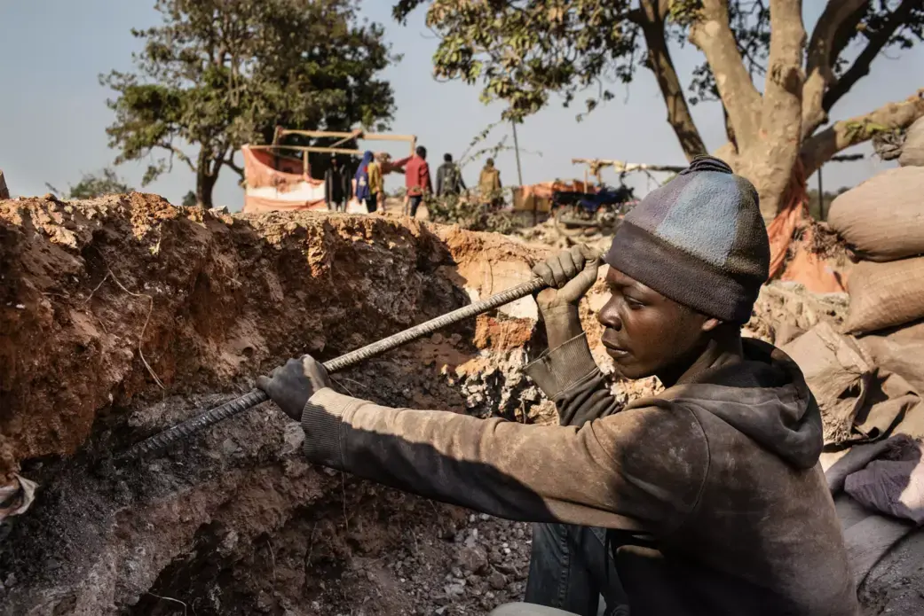 A young miner digs for cobalt inside CDM's Kasulo mine. Image by Sebastian Meyer. Democratic Republic of Congo, 2018.