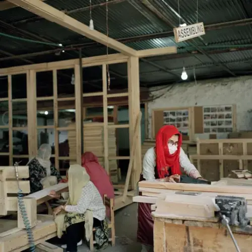 Bibi Farman, a 32-year-old female carpenter, is one of 40 women who work at a carpentry workshop in Karimabad, a village in the Hunza valley. “I am gaining skills,” Farman says. “I am earning money. I support my family and it built up my confidence. Many girls share their problems here. We are a community.” Image by Sara Hylton/National Geographic. Pakistan, 2019.