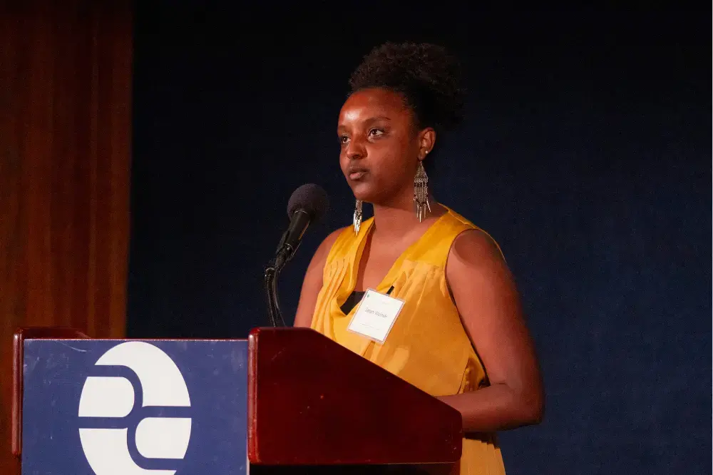 Selam Weimer reads from her poem inspired by Moises Saman's photo in 'Iraq's Post-ISIS Campaign of Revenge' by Ben Taub. Image by Jin Ding. United States, 2019.