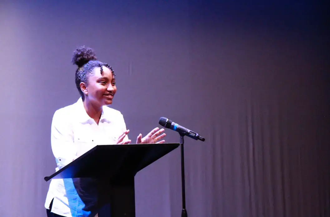 A student journalist presents her final project on student athletes during the final presentation of the Soul of the City program. Image by Kate Karstens. United States, 2018.