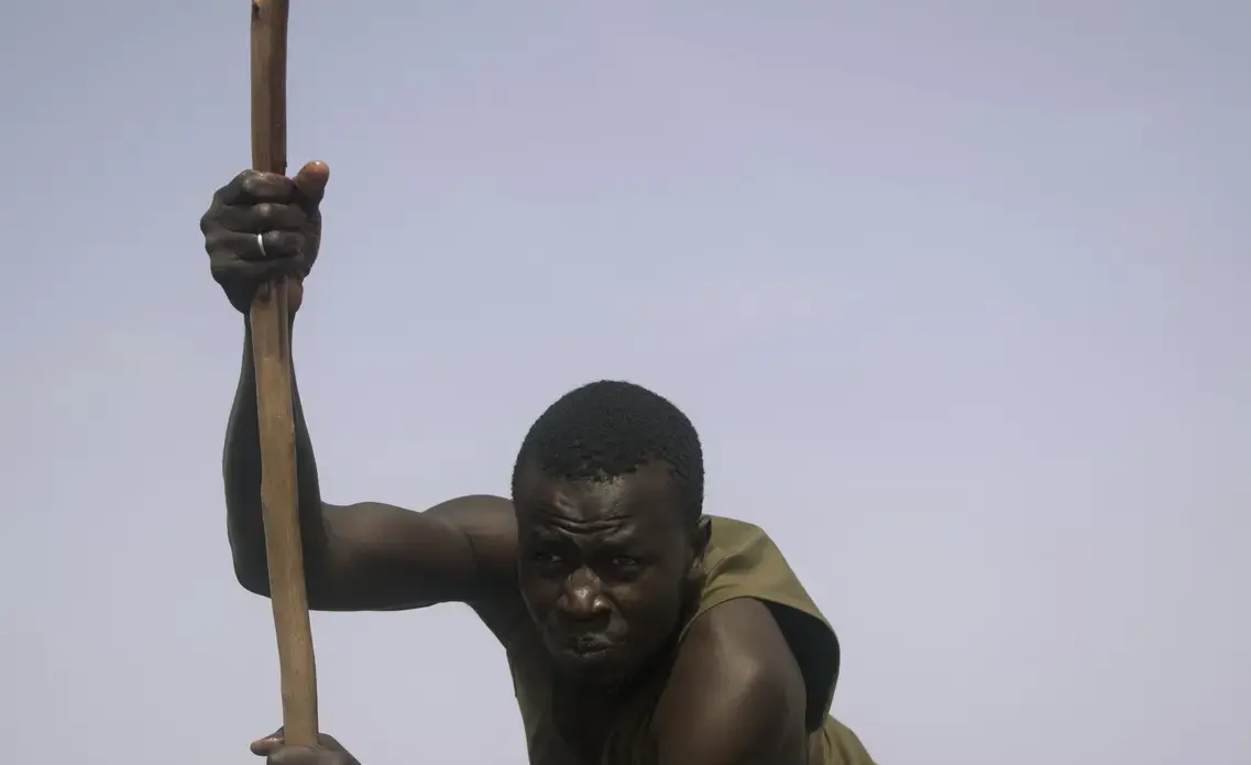 As he poled our group of 10 across Lac Rose outside of Dakar, I was struck by our boat-guide’s expression of determination. His job was to take groups, like ours, across the salty lake, whose algae causes it to turn pink in the sun. Image by Sydney May. Senegal, 2018.