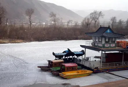 The Tumen River, which separates China (near side) and North Korea (far side). One woman told Newsweek she smuggles ice to a trader in the middle of this river; which demarcates the northern and more accessible border crossing point between the two countries; it’s frozen during the winter and often laxly patrolled. Jilin Province, China. 2011. Media file: tumen-river-drug-smuggling-11_9775_10978_10993.jpg