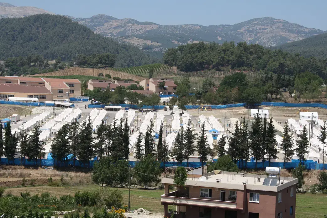 A flood of Turkmen from Syria have fled to this new camp, which is providing refuge for 2,500 villagers. The camp is one of several the Turkish government has been forced to set up to deal with a crush of refugees. Image by Stephen Franklin. Turkey, 2012. Media file: turkmen.jpg