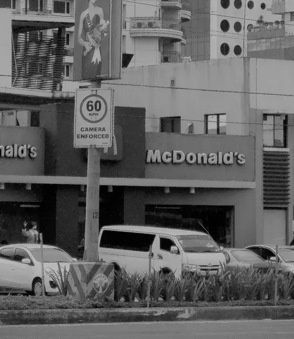 Metro Manila’s problem: Seeing a sign showing speed limits in the megacity is like finding buried treasure. This sign can’t be seen for the surrounding visual clutter. Image by Dinna Louise C. Dayao. Philippines, 2017.