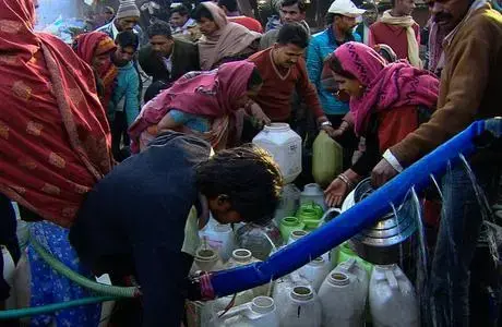 Drinking water for Delhi's slum dwellers comes daily—though not at any predictable time—in a municipal tanker. 2010. image