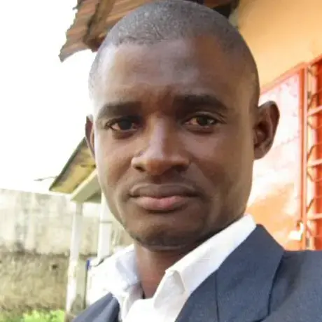 Christian Locka-30 (1).jpg Pulitzer Center grantee Christian Locked dressed in a suit.