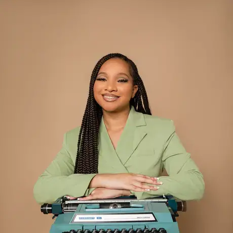 AlexisM3.jpg Alexis McGowan poses with an electric typewriter