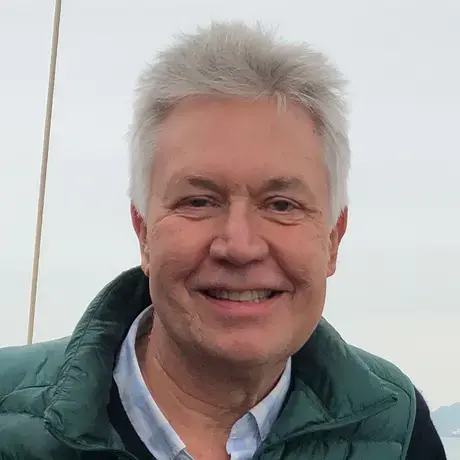 Jon Sawyer stands next to a bay