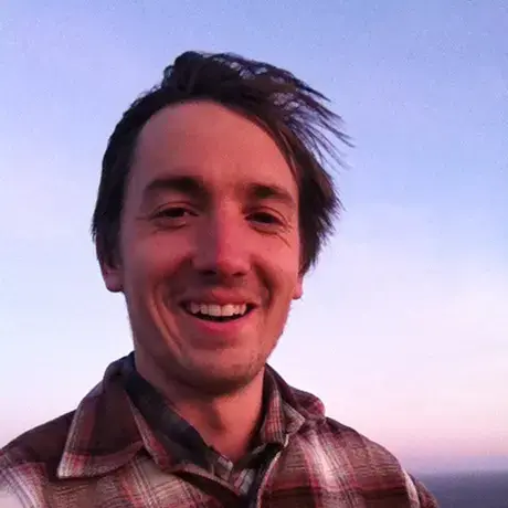 NateHegyi.jpg Photo of Nate Hegyi in plaid shirt at sunset
