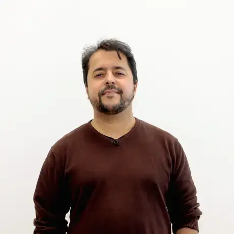 Carlos Minuano wearing a red sweater