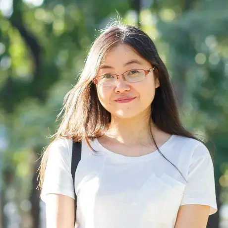 LQ.jpeg A person wears glasses and a white shirt.