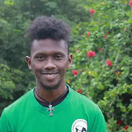 Image of a person wearing a green shirt.