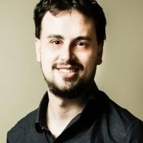 Daniel_Enrique_300x300_0.jpeg A man with short brown hair and wears a black shirt.