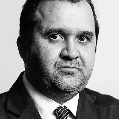 A man looks into the camera