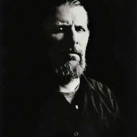 Black and white image of a headshot of a man