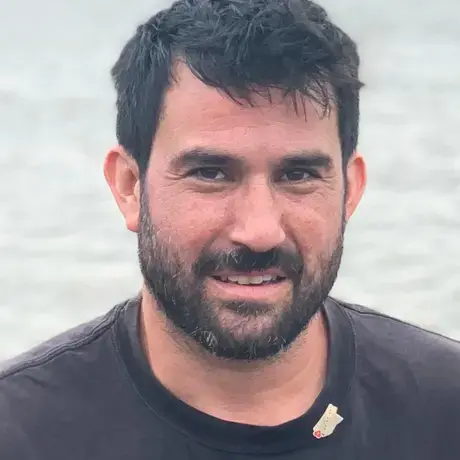 A man with short hair and a beard