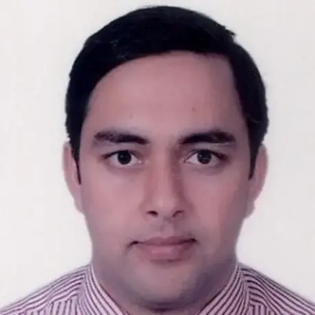 Headshot of a man with short dark hair wearing a striped collared shirt