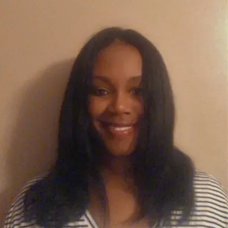 A photo of Joi Womack smiling into the camera