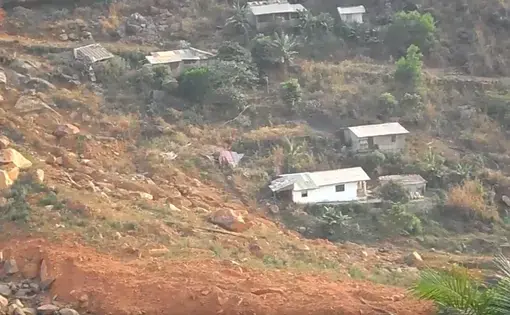 The scarred site of Sugar Loaf Mountain that came tumbling down August 2017 claiming the lives of more than 1,000 Sierra Leoneans. Image by Kadia Goba. Sierra Leone, 2018. The scarred site of Sugar Loaf Mountain that came tumbling down August 2017 claiming the lives of more than 1,000 Sierra Leoneans. Image by Kadia Goba. Sierra Leone, 2018.