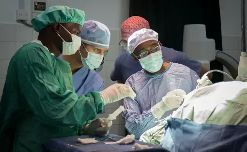 Surgeons come from all over the world to the CURE Children's Hospital in Mbale, Uganda, where doctors developed a new treatment for hydrocephalus, called endoscopic third ventriculostomy with choroid plexus cauterization, or ETV/CPC. Image by Bridget Huber. Uganda, 2014. Media file: uganda_s-0111.jpg