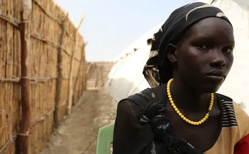 A woman named Elizabeth at the U.N. base in Bentiu, South Sudan. She fled recent fighting in Leer County. Image by Cassandra Vinograd. South Sudan, 2016. Elizabeth poses for a photo on Dec. 15, 2015 at the U.N. base in Bentiu, South Sudan. She fled recent fighting in Leer County. Image by Cassandra Vinograd. South Sudan, 2016.