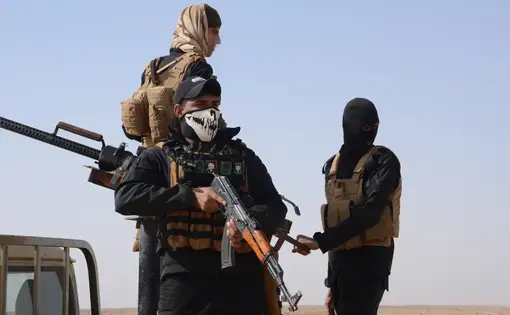 Members of Iraq's Popular Mobilization Forces patrol the deserts west of Karbala. Image by Jack Watling. Iraq, 2017.