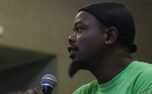 Lifeline for Success member Will raises questions about the electoral college. Lifeline is a re-entry program for formerly incarcerated men and women in Memphis, Tennessee. Most members of the community are disenfranchised. Video still by Lorraine A. Ustaris for Andrea Bruce's Our Democracy project. Media file: William