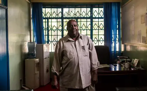 Garissa University Principal Ahmed Osman Warfa has overseen the university through its opening, the Al Shabab attack that killed 148 people on campus last year, and now its reopening after being shuttered for 10 months. He calls the university a "lifeline" for the marginalized region. Image by Will Swanson. Kenya, 2015.