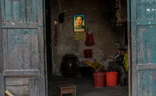 A holographic image of Mao in a rural farmhouse. Despite decades of violence and murder, Mao is still revered by many Chinese as a near god-like figure. Image by Sim Chi Yin/ VII Photo Agency. China, 2016.