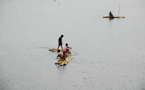 Children play with old rafts over&nbsp;flooded fields in rural Bangladesh. Image by&nbsp;Amir Jina / CC. Bangladesh, 2009.