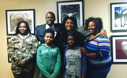 Washington, D.C. Public Schools Chancellor Antwan Wilson visits the Everyday DC exhibit with its student curators and their teacher.  Image by Fareed Mostoufi. United States, 2018.