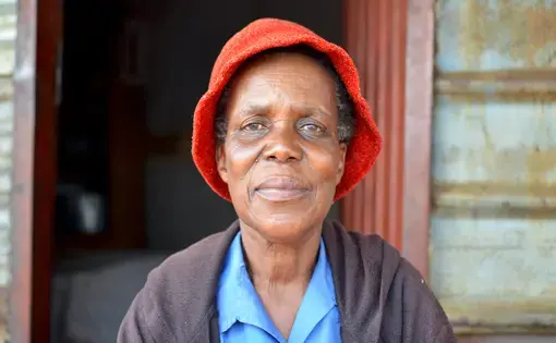 Rebecca Lebeta, a resident of the Masakhane informal settlement, waits for promised relocation. Image by Mark Olalde. South Africa, 2017.
